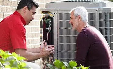 homeowner-inspecting-new-ac